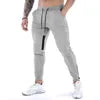 Men's Sports Fitness Long Pants with Pockets Casual Drawstring Trousers Slim Fit Outdoor Streetwear Breathable Eco-Friendly