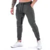 Men's Sports Fitness Long Pants with Pockets Casual Drawstring Trousers Slim Fit Outdoor Streetwear Breathable Eco-Friendly