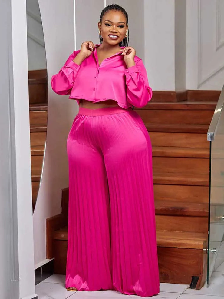 Elegant pink long sleeve button top and pleated pants set for women, perfect for autumn casual occasions, plus size available.