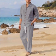 Men's Cuban style fashion shirt, multi-button stand collar, loose fit, beach setting.