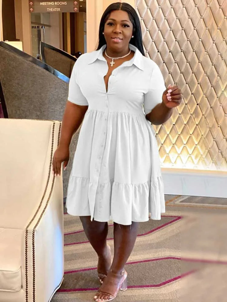 Plus size white shirt-style summer dress with short sleeves and buttons.
