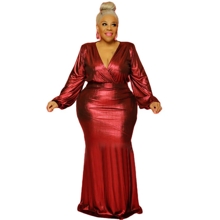 Plus size floor-length red dress with V-neck and long puff sleeves, ideal for formal occasions.