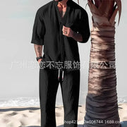 Men's summer casual cotton linen two-piece set with V-neck half sleeve top and loose fit pants.