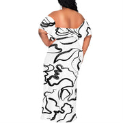 Plus size off-shoulder maxi dress with black and white sketch art print, floor-length silhouette.