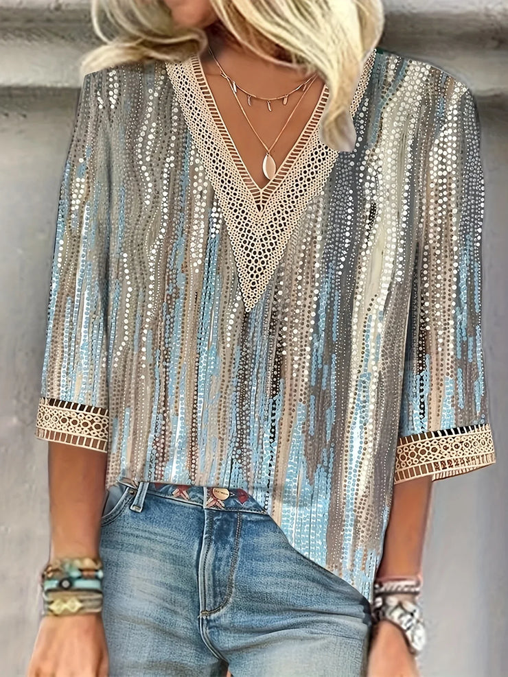 Elegant loose fit woman shirt with long sleeves, printed pattern, suitable for casual wear.