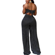 High street casual style jumpsuit with backless design, dot pattern, and wide leg pants.