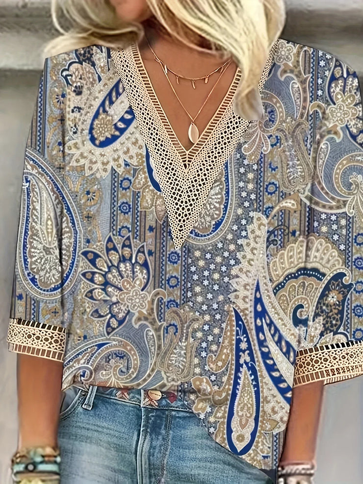 Elegant loose fit woman shirt with blue paisley print, long sleeves, and casual style.