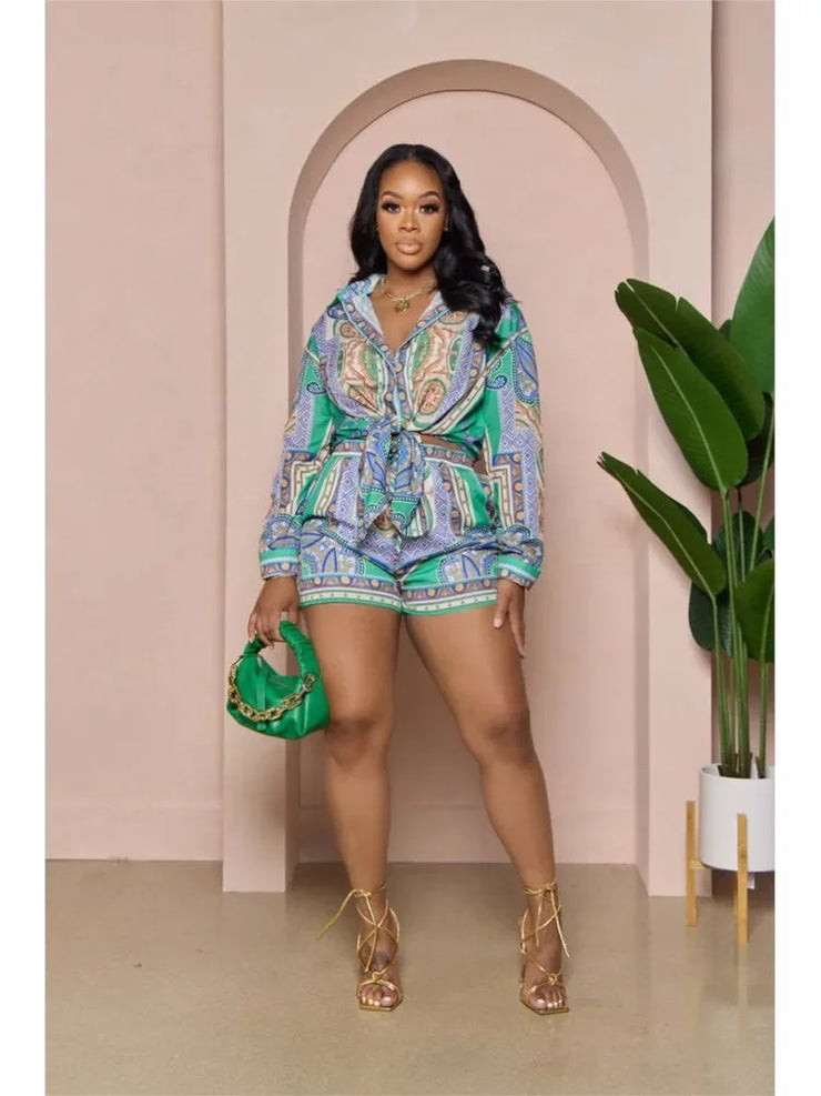 Casual 2 pieces set for women featuring a long sleeve flower print shirt and elastic waist shorts, perfect for spring and summer fashion.